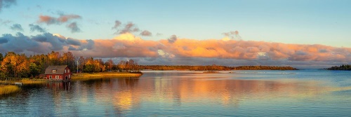 Obraz západ slunce nad klidným jezerem