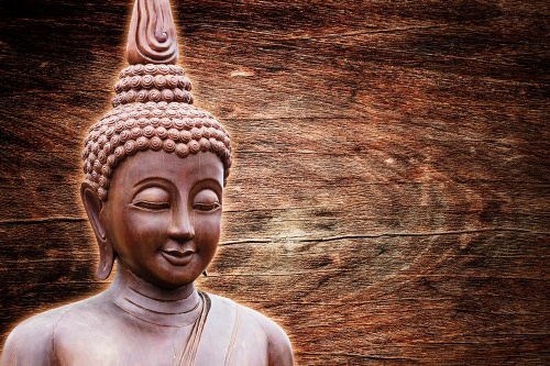 Samolepící tapeta socha Buddhy na dřevěném pozadí